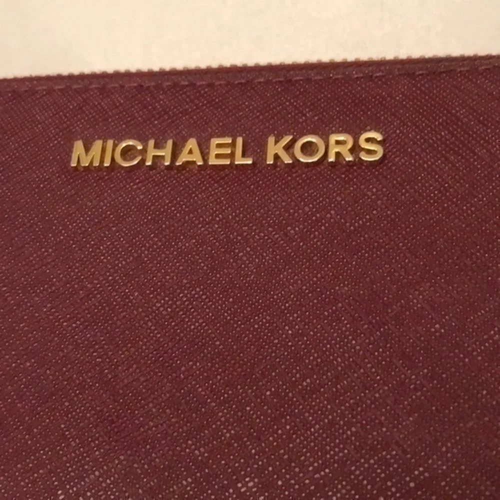 Michael kors burgundy continental zipper wallet